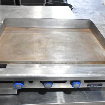 Imperial Commercial Gas Flat Top Griddle, countertop model with three blue knobs, stainless steel, used condition.