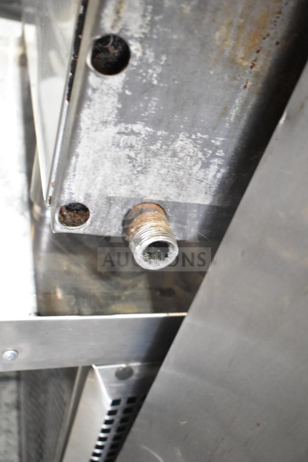 Imperial Commercial Gas Flat Top Griddle, worn condition, features metal connection points with visible rust marks.