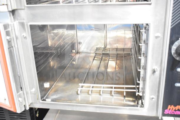 Groen HY 6E electric steam cabinet, 2 deck, 208V, 3-phase, stainless interior, open door view, commercial use.