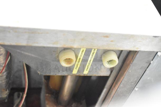 Groen HY 6E Steam Cabinet connectors with labels for treated and untreated water supply; visible wear.