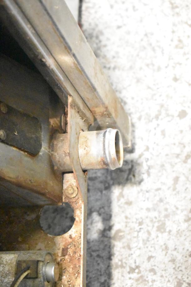 Groen HY 6E commercial steam cabinet component, displaying metal pipe and connection area, showing signs of wear.
