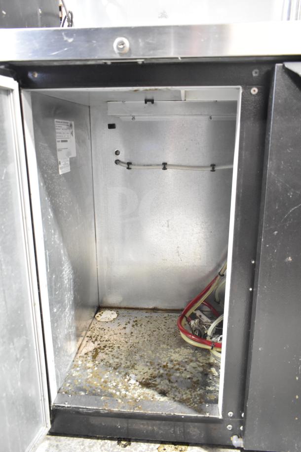 Beverage Air DD48HC-1-B-138 kegerator interior, showing wiring and slight wear. Includes a 4-tap beer tower, 115V, 1 phase.