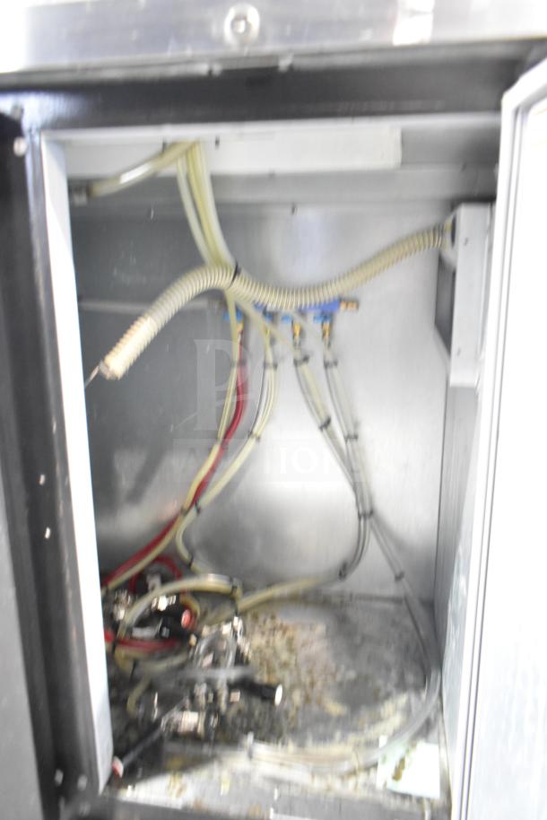 Beverage Air DD48HC-1-B-138 kegerator interior view showing tubing and connections, uses 115 volts, 1 phase power.
