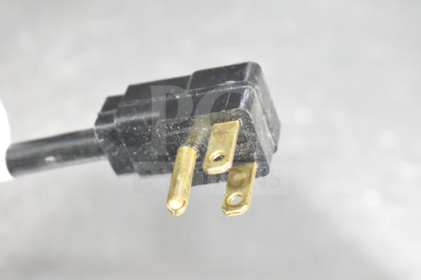 Close-up of a three-prong power plug for the Beverage Air DD48HC-1-B-138 kegerator, showing slight wear.