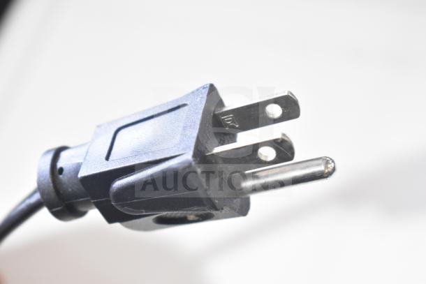 Close-up of a 3-prong power plug for a Hamilton Beach MSF0W100072352 Countertop Microwave Oven, 120V, 1 Phase.