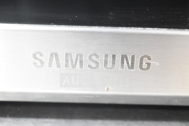 Samsung MC17T8000CS countertop microwave oven, stainless steel, 120V, 1 phase, model number visible on front panel.