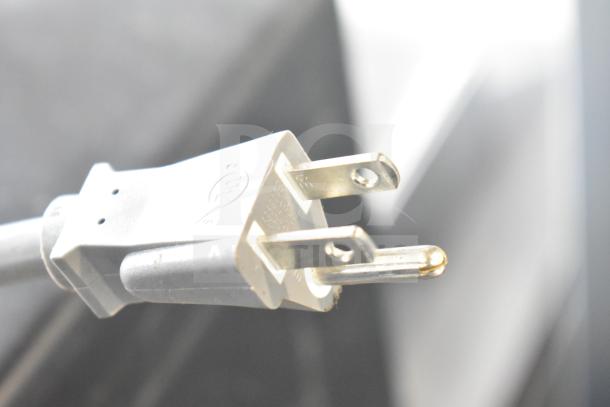 Close-up of a power plug, part of the Samsung MC17T8000CS Countertop Microwave Oven. 120 Volts, 1 Phase.