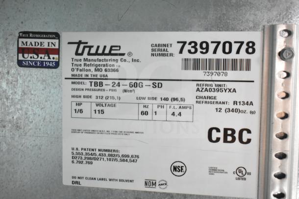 True TBB-24-60G-SD commercial back bar cooler label showing model, voltage (115V), and refrigerant details (R134A). Made in USA.