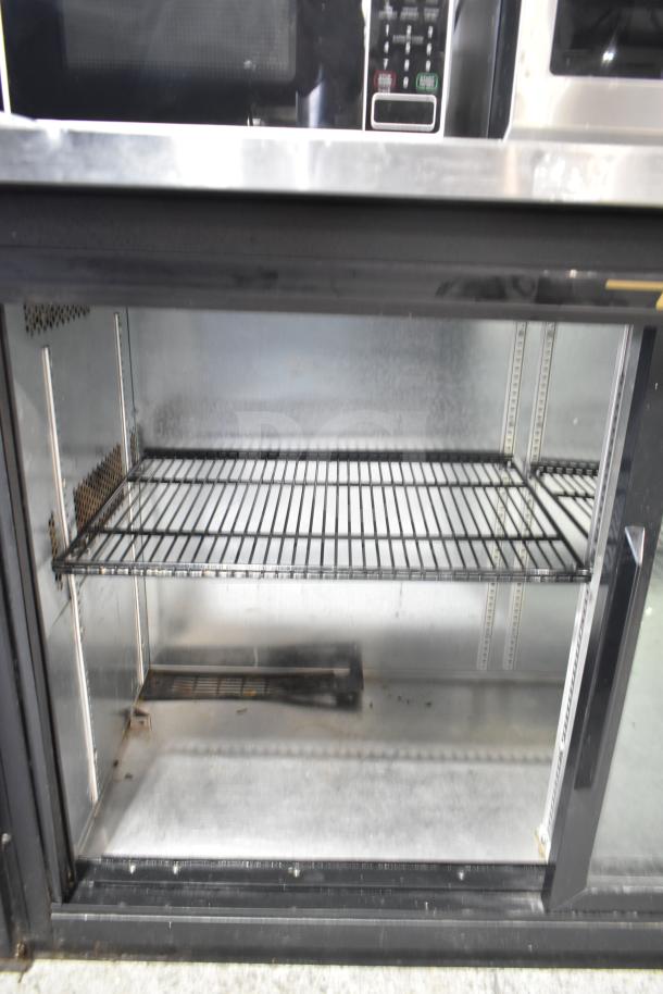 True TBB-24-60G-SD back bar cooler; 2 glass doors, commercial use, stainless steel interior, 115 volts, 1 phase, used condition.