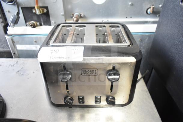 Black & Decker TR7847-18D countertop toaster with 4 slots, 120V, 1 phase. Visible brand logo and controls. Used condition.