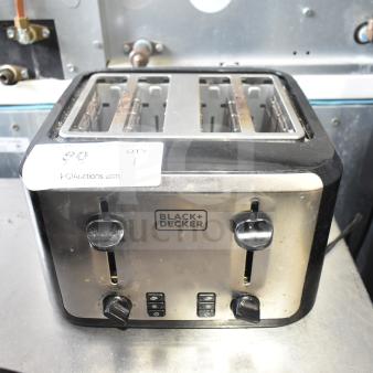 Black & Decker TR7847-18D countertop toaster with 4 slots, 120V, 1 phase. Visible brand logo and controls. Used condition.