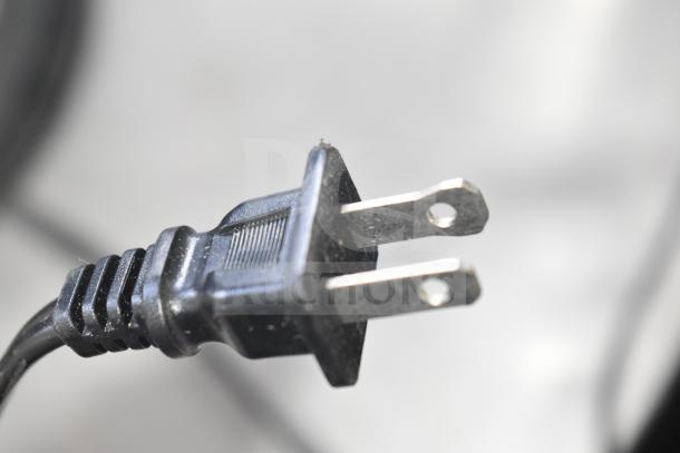 Close-up of a plug from the Black & Decker TR7847-18D 4-slot toaster, 120 volts, 1 phase. Plug shows standard two-prong design.