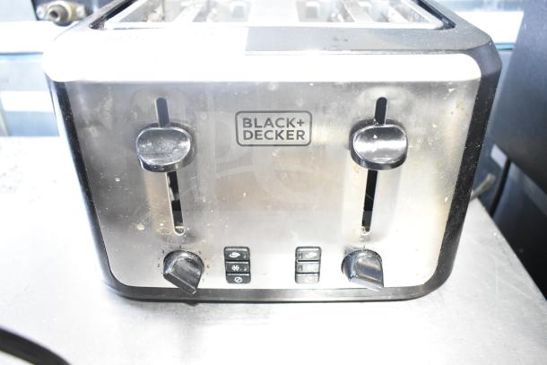 Black & Decker TR7847-18D 4-slot toaster, stainless finish, used condition, visible controls and settings.