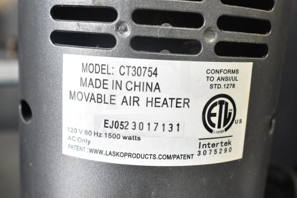 Lasko CT30754 heater, 120V, showing label with model, origin, ANSI/UL conformity, 1500 watts, and patent info.