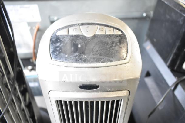 4 various items including Chung Yuan TF-810S 9" tabletop fan, Lasko CT30754 heater, Lasko 755320 heater, Vornado 143 air circulating tower fan. 120V, 1 Phase. Dust visible on surfaces.