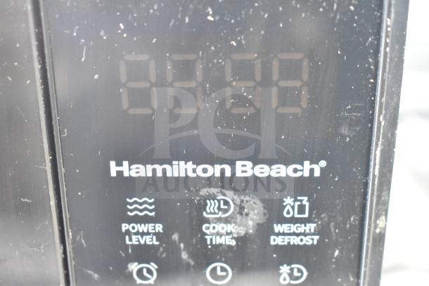 Hamilton Beach HB61B100027880 countertop microwave display, showing power level, cook time, and weight defrost options.