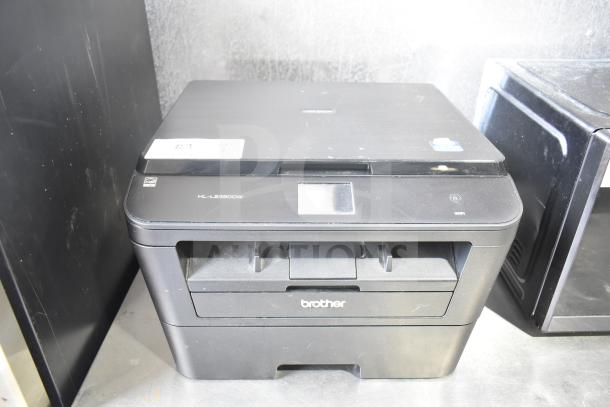 Brother HL-L2380DW printer, copier, and scanner on a countertop. Model number visible, in good condition.