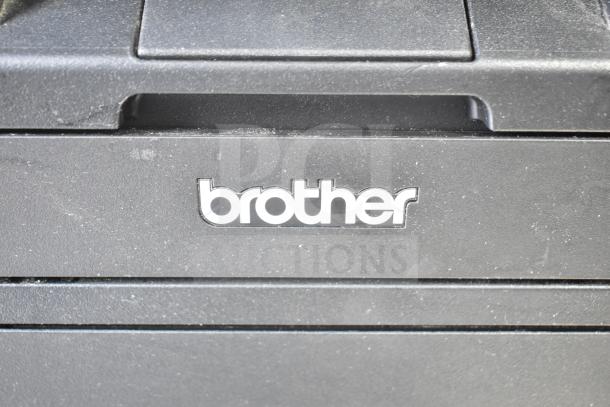 Brother HL-L2380DW printer showing brand logo on a black panel, indicating scan and copy functions. Good condition.
