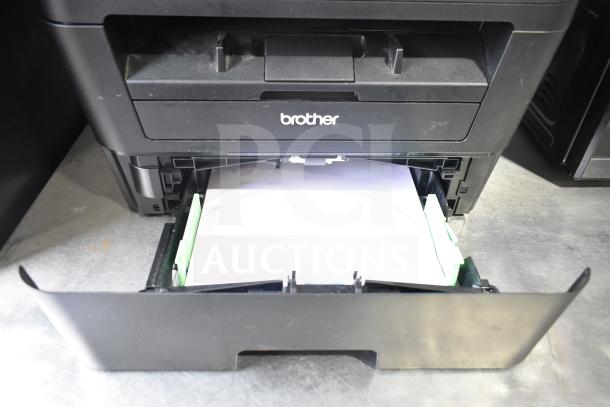 Brother HL-L2380DW printer with paper tray open, featuring copy and scan functions. Appears in good condition.