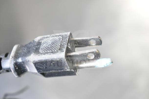 Power plug for Brother HL-L2380DW printer. Slightly dusty, indicating prior use. No visible damage or fraying.