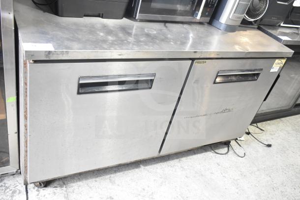 Yukon YUC-60F commercial 2-door undercounter freezer, 115 volts, 1 phase, stainless steel, visible wear, Yukon label.