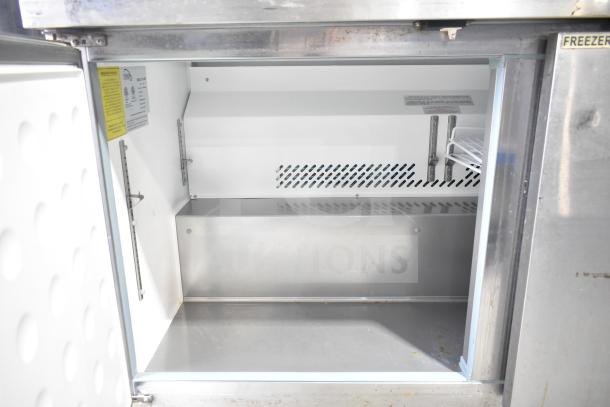 Yukon YUC-60F commercial 2-door undercounter freezer, stainless steel, 115V, 1 phase. Open door showing interior space.