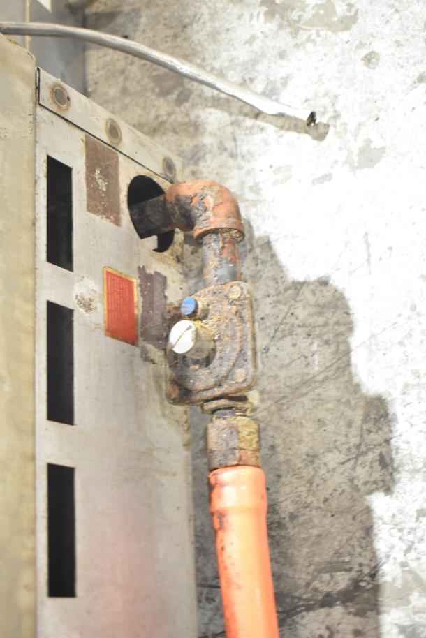 Prince Castle FHP48-2RB, showing rusted gas connections. Natural gas-charbroiler, countertop model, 4 burners.