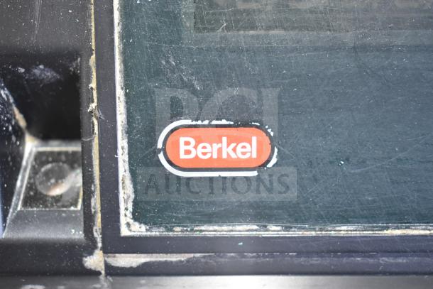 Berkel countertop food portioning scale, 115 volts, 1 phase, showing brand logo. Scratches visible on surface.