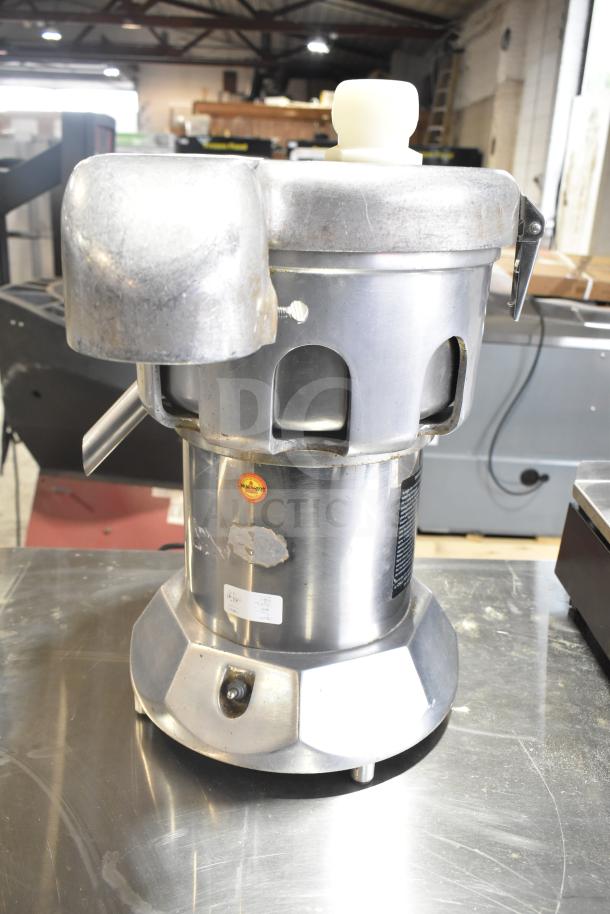The Ruby 2000 commercial countertop citrus juicer, 115-117 volts, used, stainless steel body with visible labels and wear marks.