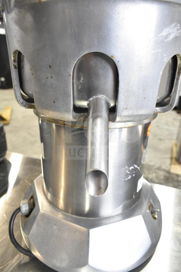 The Ruby 2000 Commercial Countertop Citrus Juicer, steel finish, 115-117 volts, 1 phase, used condition, stainless steel spout.