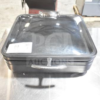 Square black container with transparent lid and chrome handle, labeled "Spring Bin." Appears in used condition.