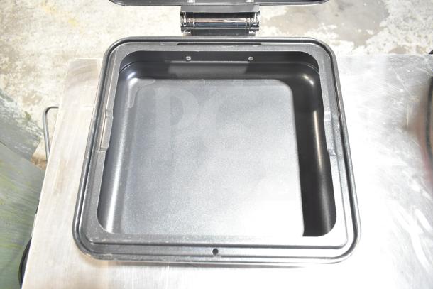 Spring Bin with a sleek, dark interior and sturdy metal frame, in excellent condition, ideal for storage solutions.