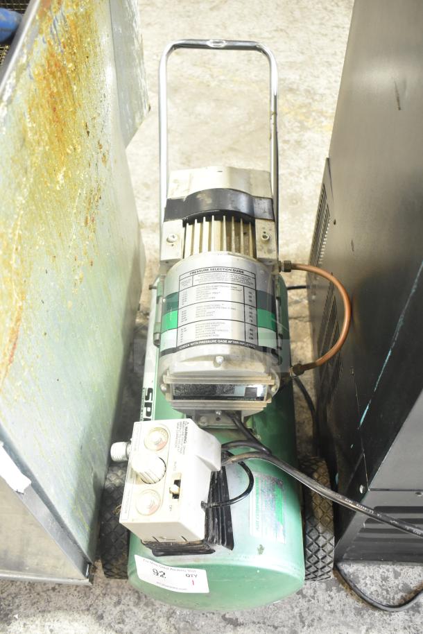Speedaire 5Z032A Direct Drive Air Compressor; visible pressure guide and control panel; appears in used condition.
