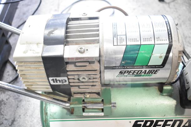 Speedaire 5Z032A Direct Drive Air Compressor, 1hp, visible wear, operational labels, made in USA, built with GE electric motor.