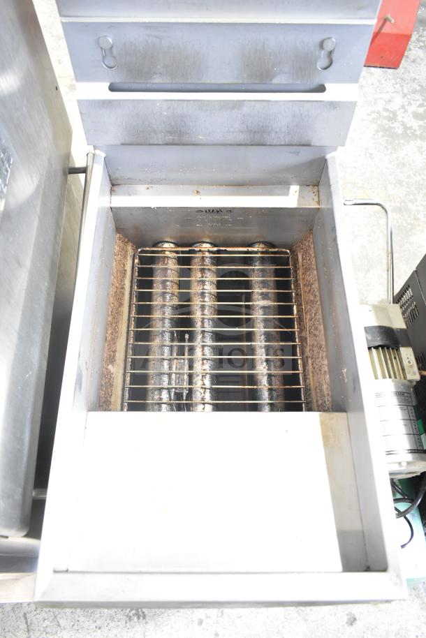 Pitco Frialator 35C commercial natural gas fryer, 90,000 BTU. Floor style, showing interior heating elements and grease tray.