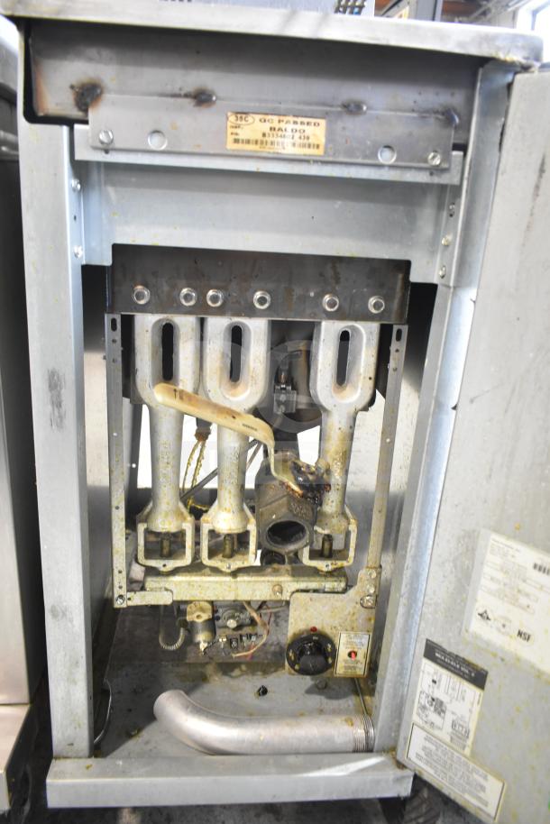 Pitco Frialator 35C commercial deep fat fryer, natural gas, 90,000 BTU, visible labels, internal view, used condition.