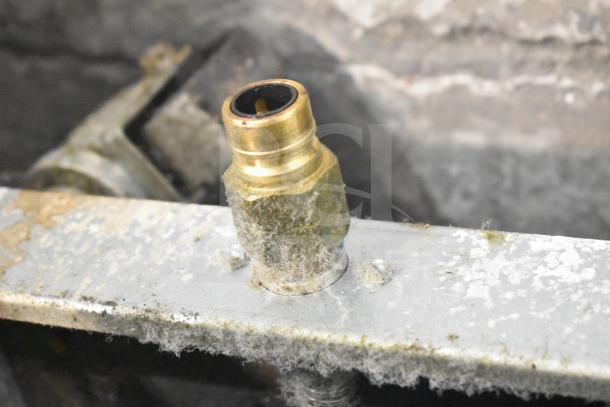 Close-up view of a connector on a used Pitco Frialator 35C Fryer. Appears weathered, indicative of past use.