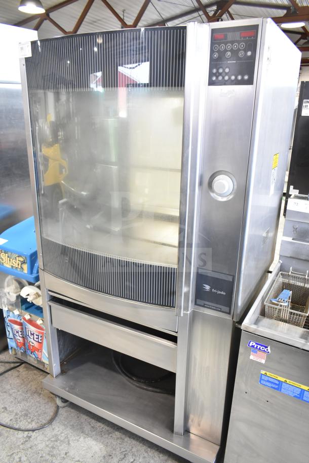 Fri-jado STG 7-P Commercial Electric Rotisserie Oven on casters, 208V, 3-phase. Stainless steel, control panel visible.