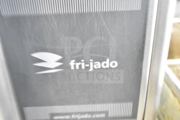 Fri-jado STG 7-P commercial rotisserie oven, electric, 208 volts, 3 phase, on casters, logo visible, good condition.