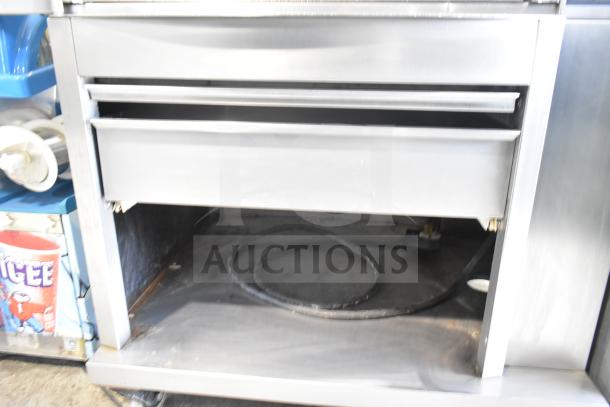 Fri-jado STG 7-P commercial electric rotisserie oven on casters, 208V, 3-phase, stainless steel, partially open drawer.