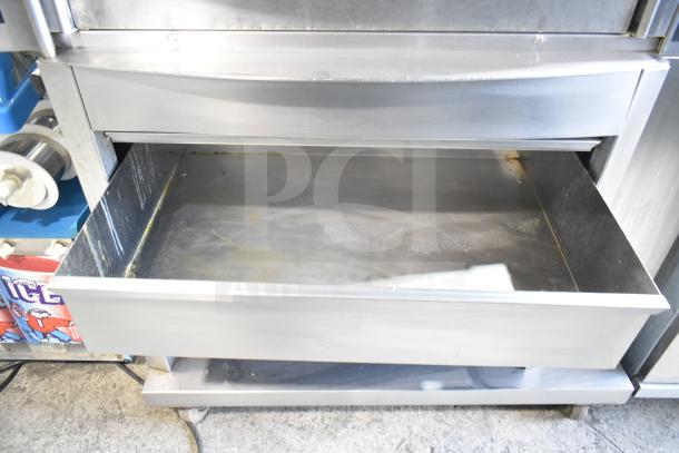 Fri-jado STG 7-P rotisserie oven with open drip tray, stainless steel, on casters. Electric, 208V, 3-phase.