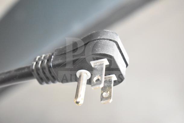 Close-up of the plug from a Turbo Air M3F47-2-N Commercial 2 Door Reach In Freezer, 115 Volts, 1 Phase.