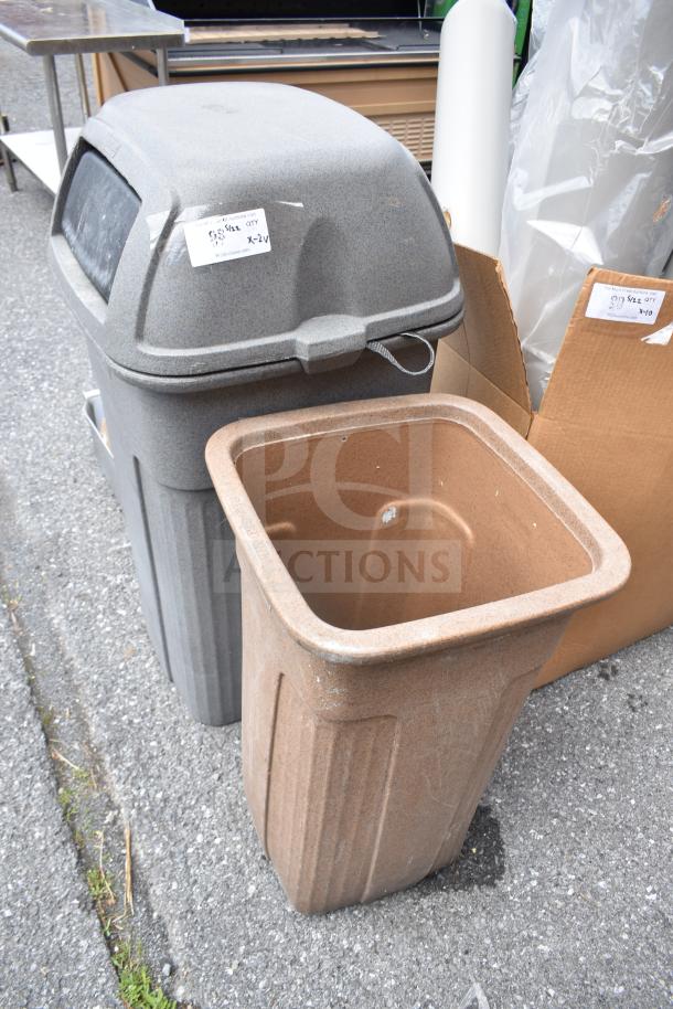 Two poly trash cans, one gray with a lid, one brown without; both show signs of wear. Labels indicate auction details.