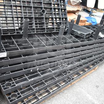 Lot of 7 black poly shelf pieces, sturdy construction, used condition. Features grid design, suitable for storage setups.