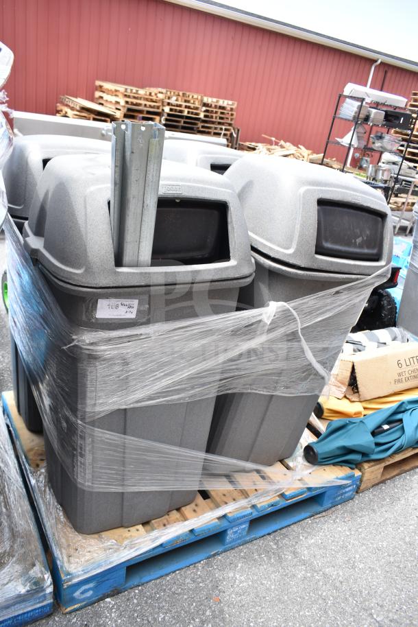 Seven grey outdoor trash cans, wrapped on a pallet, in good condition. Includes metal support beams and partial labeling.