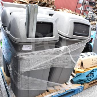Seven grey outdoor trash cans, wrapped on a pallet, in good condition. Includes metal support beams and partial labeling.