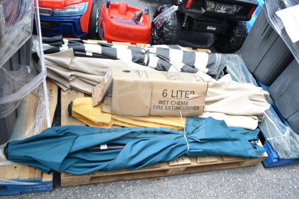 5 assorted items including 4 closed patio umbrellas in various colors and a 6-liter wet chemical fire extinguisher in box.