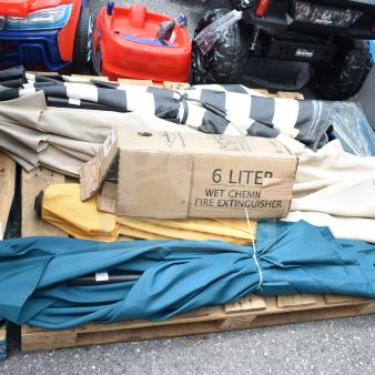 5 assorted items including 4 closed patio umbrellas in various colors and a 6-liter wet chemical fire extinguisher in box.