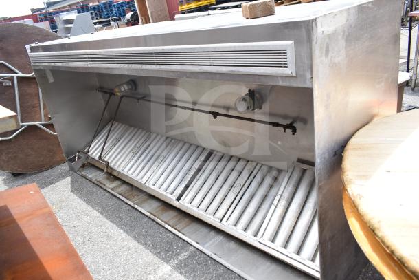 9.5 commercial return air grease hood with filters and lights, stainless steel, industrial condition, exterior scratches visible.