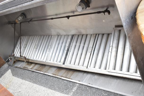 9.5 ft commercial return air grease hood with filters and integrated lights, stainless steel, used condition.